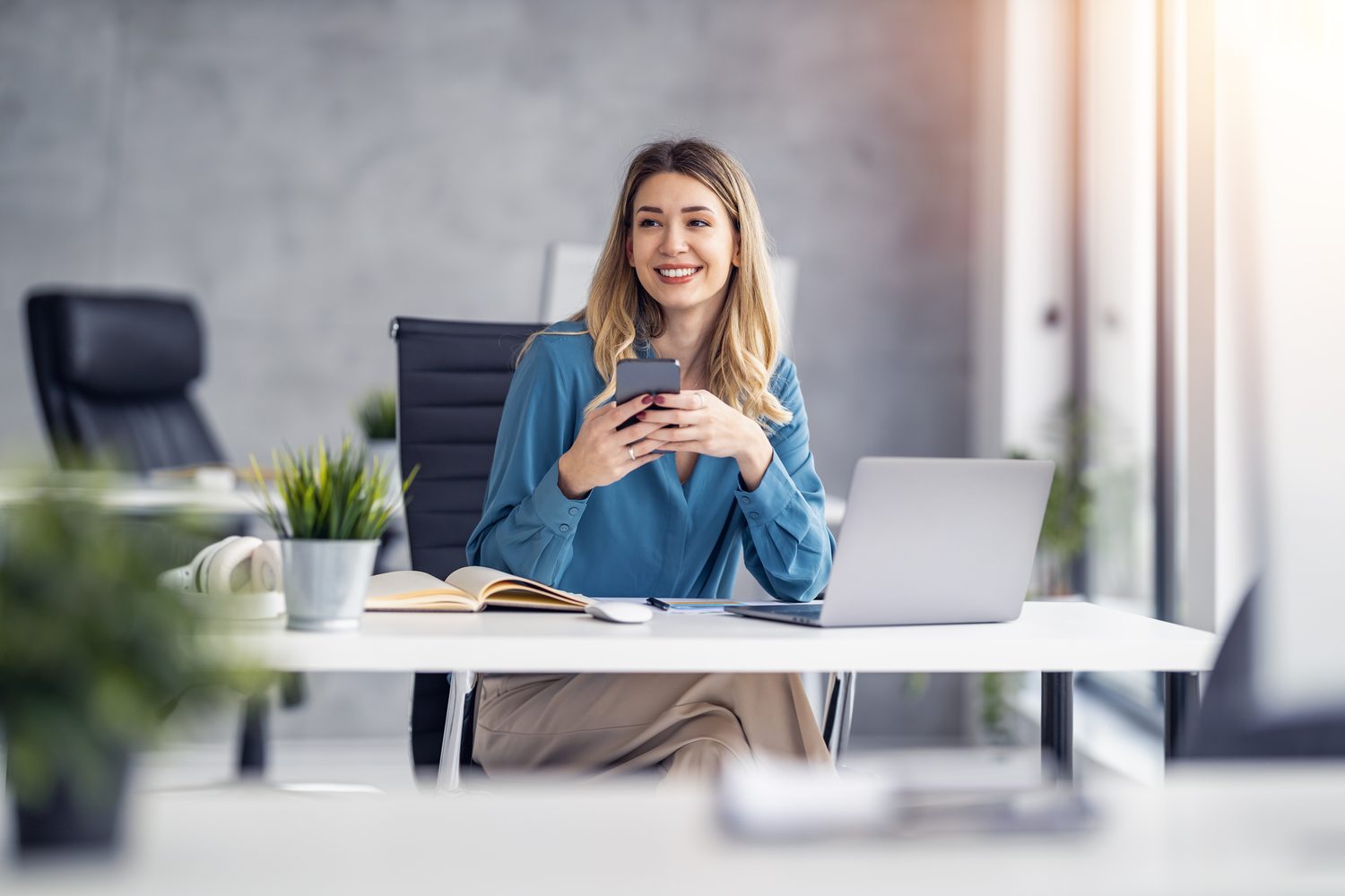 A property manager reviewing work on a laptop